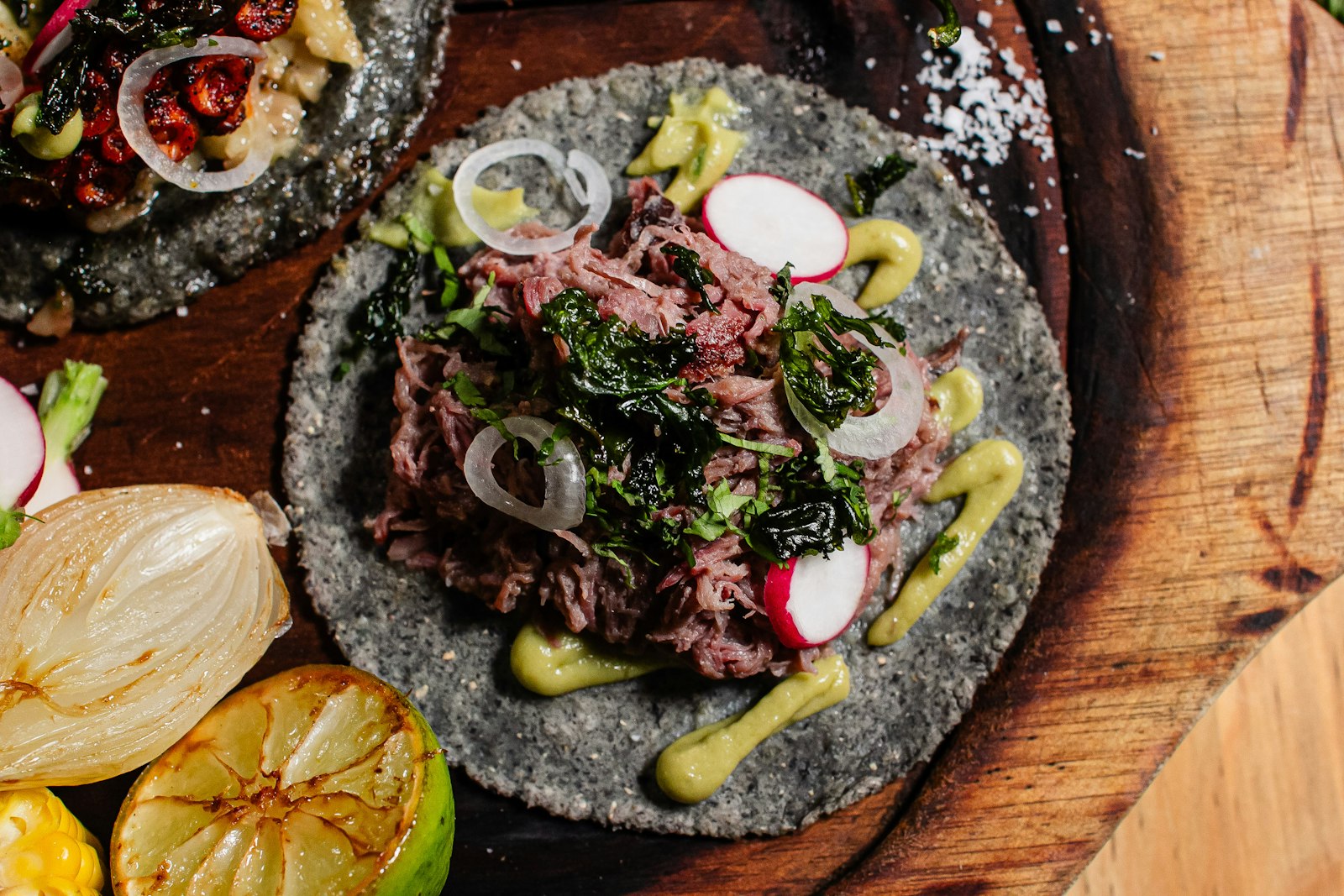 Upscale tacos plate with avocado on ceramic — Dubai casual dining, UAE street food upscale