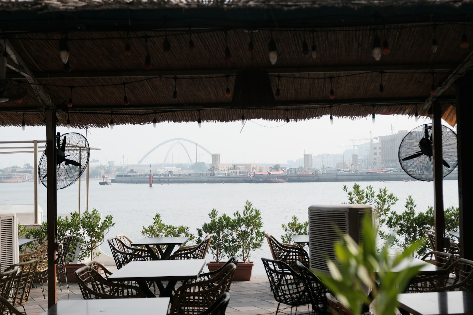 Outdoor dining terrace overlooking Dubai cityscape evening — QSR .ae lifestyle